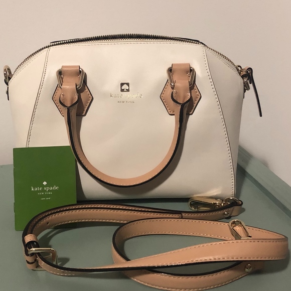 white luggage with leather trim